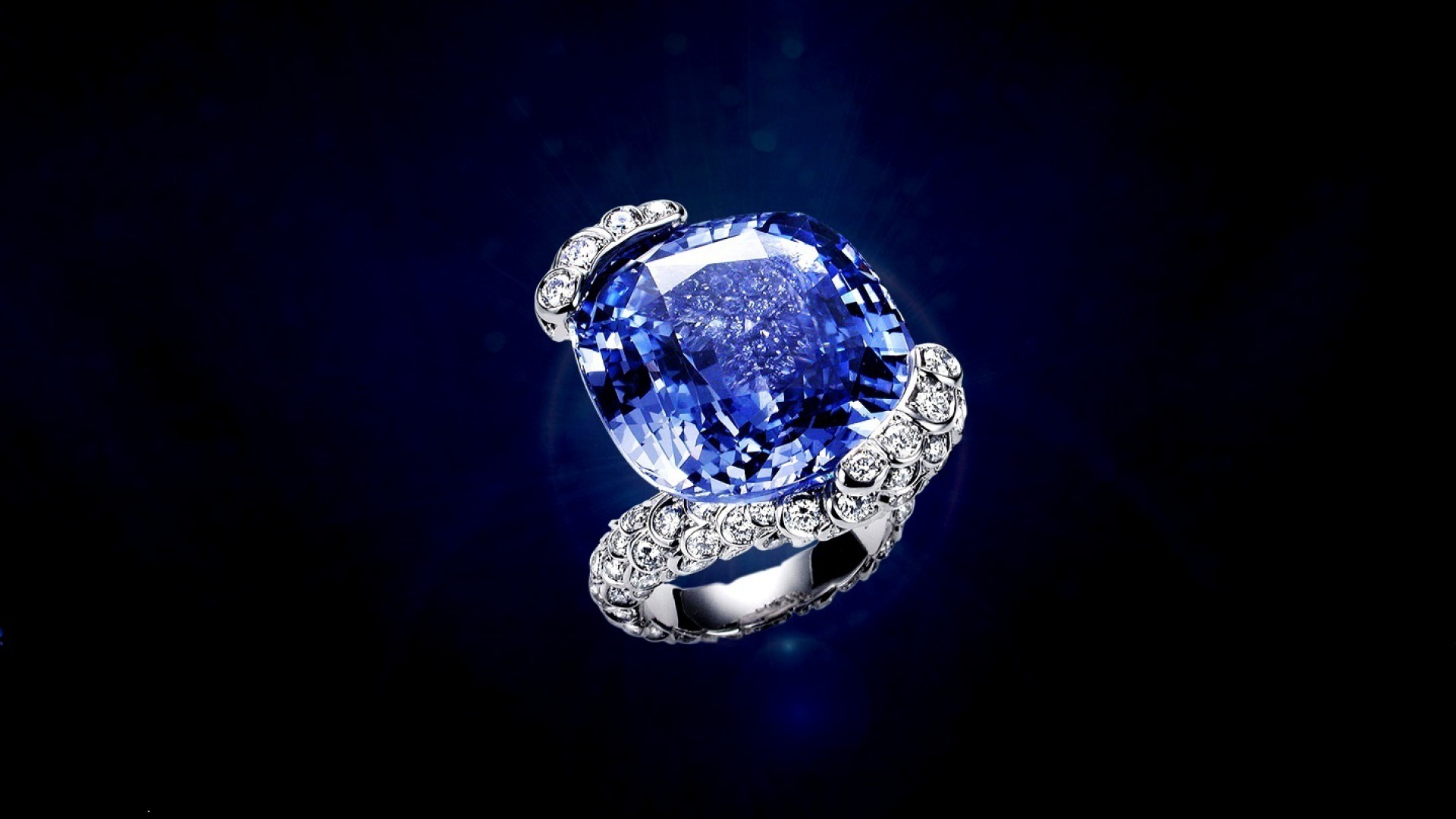 Сапфир фэнтези. Кольцо Chopard Blue Diamond. Камень Диамант Даймонд кольцо. Ювелирные украшения фон. Сапфировые украшения.