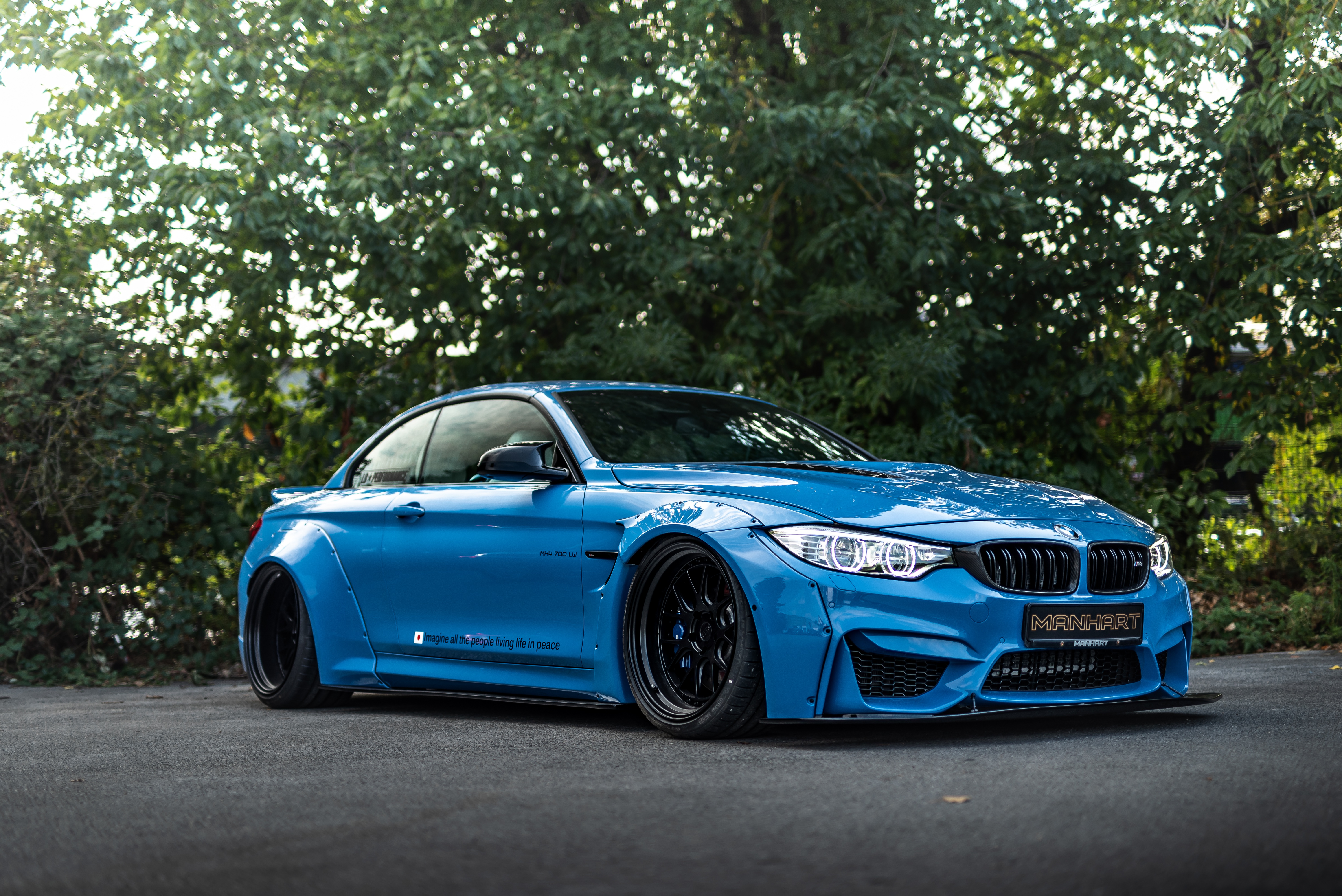 Машина м 4. BMW m4 в обвесе. БМВ m4 тюнингованная. BMW m4 tuned. BMW m4 Manhart.