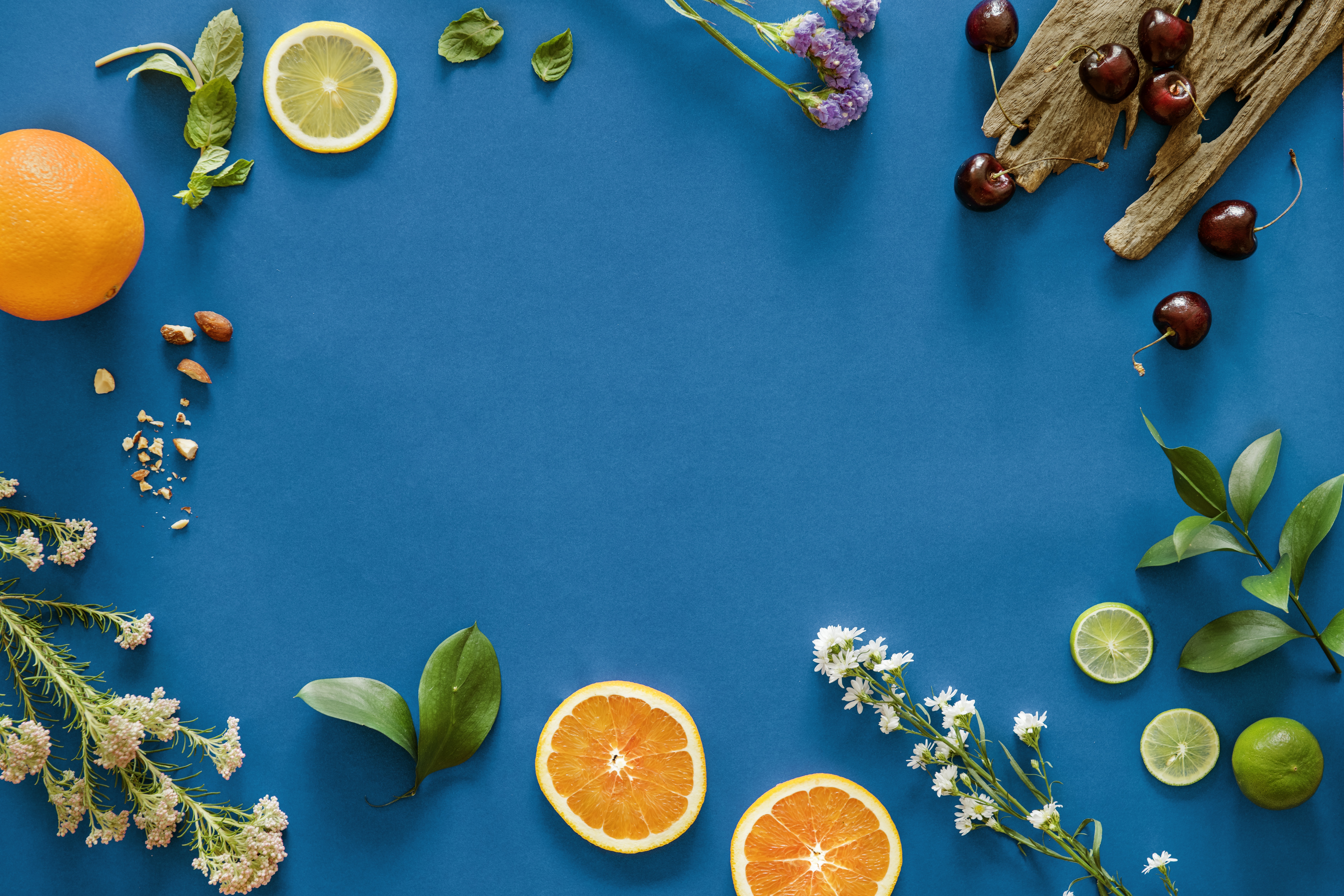 Растения меню. Фрукты фон. Фотофон фрукты. Апельсин на синем фоне. Фрукты на столе вид сверху.