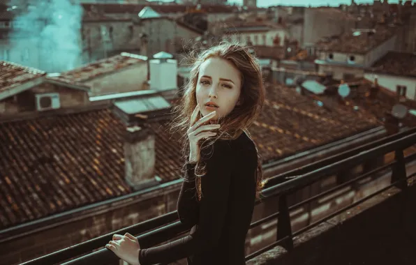 Girl, smoke, hair, wind, roofs, cityscape