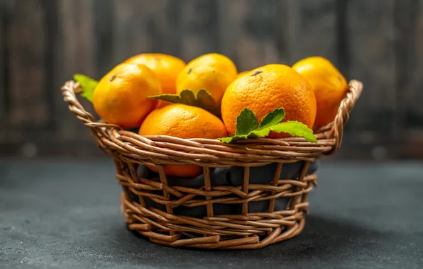 Листья, стол, апельсины, фрукты, серый фон, корзинка, боке, композиция