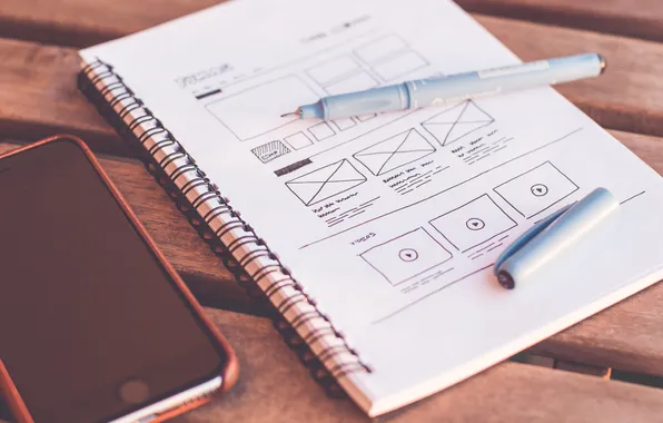 Notes, pen, cell phone, planning