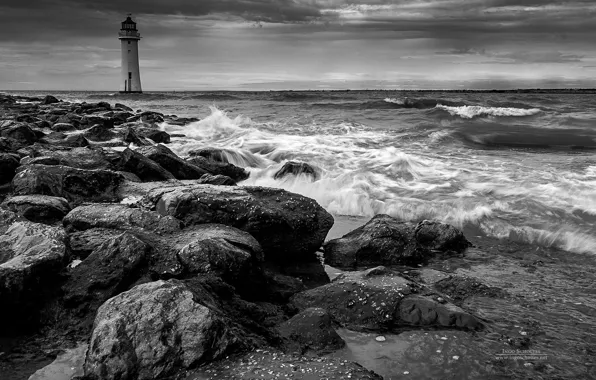 Sea, rocks, lighthouse