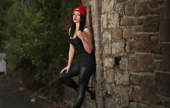 Wall, hat, women, high heels, black clothes