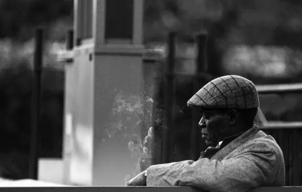 Smoking, hat, cityscape, older man