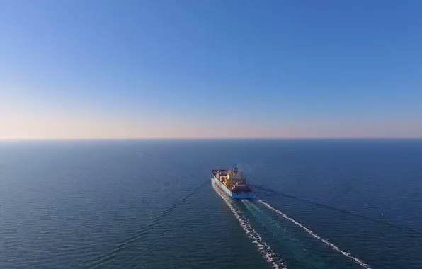 Aerial view, after loading, container ship, floats in the open ocean