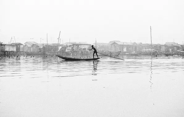 River, boy, canoe, poverty, stilt houses