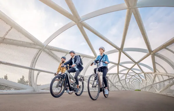 Woman, man, electric bike