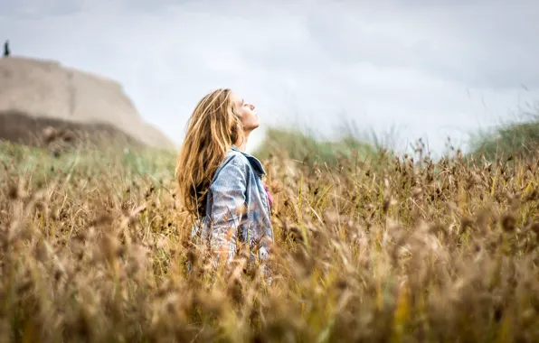 Girl, rock, field, bokeh, person