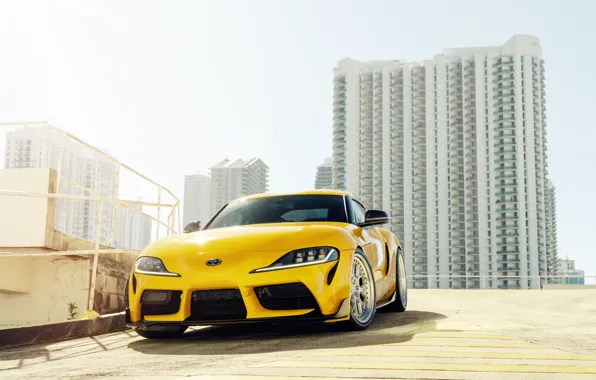 Картинка жёлтый, здания, спорткар, вид спереди, Toyota Supra, 2020 Toyota GR Supra
