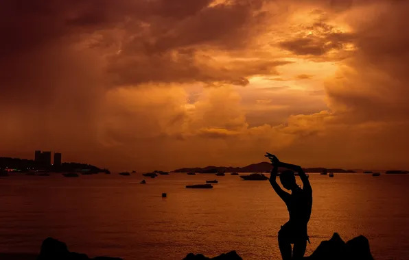 Sunset, clouds, silhouette of a girl