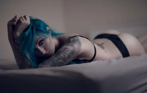 Lingerie, tattoos, blue hair, laying down