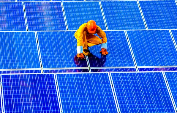 Worker, solar panels, solar energy
