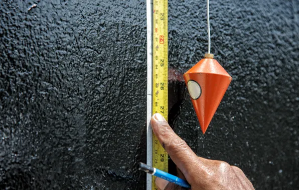 Wall, tape measure, plumb