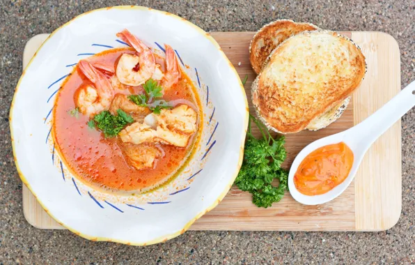 Greens, shrimp, tomato sauce, seafood soup, croutons