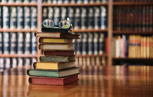 Glasses, table, books, library