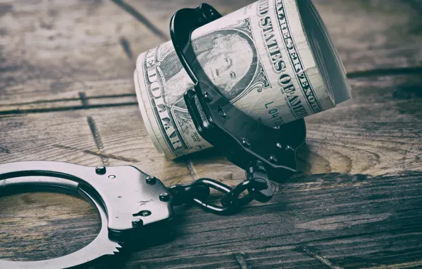 Money, metal handcuffs, bail