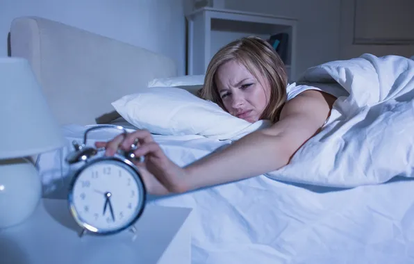 Bed, alarm clock, sleeplessness