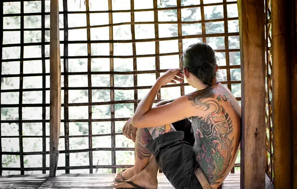 Window, tattoos, sits, casual, flip flops