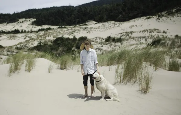 Grass, dog, man, sand, shadows, wind, dune, sunny