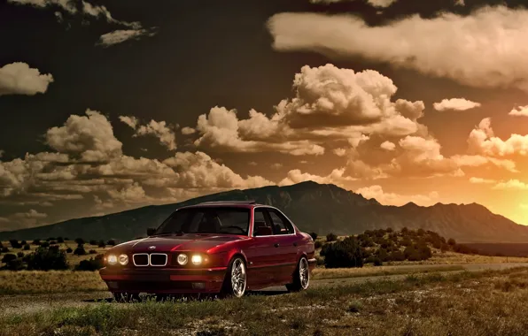 Картинка небо, солнце, облака, закат, горы, бмв, BMW, red