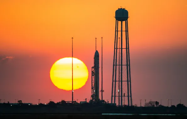 Картинка солнце, закат, ракета, NASA, космодром, Antares