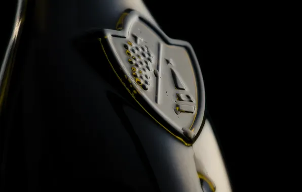 Emblem, black background, bottle