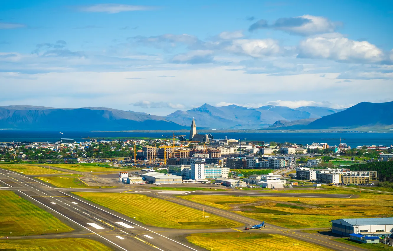 Фото обои coast, mountains, clouds, airport, houses, plane, Iceland, Reykjavik