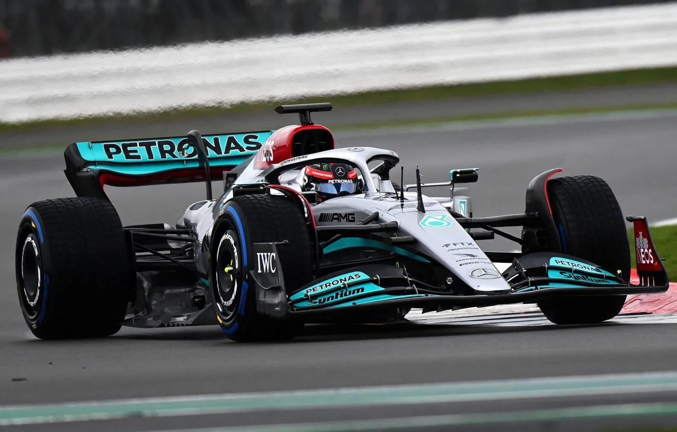 F1 Drivers sit in car