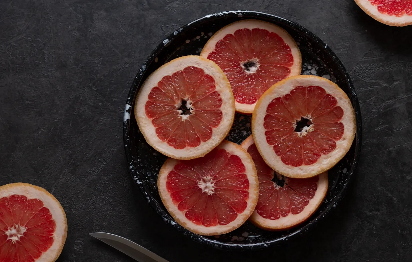 Фото обои тарелка, нож, грейпфрут, дольки