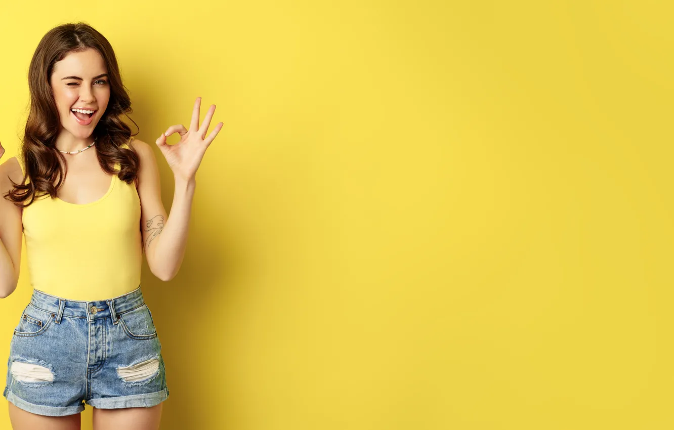 Фото обои woman, yellow, signs, smiling, standing, okay, smth