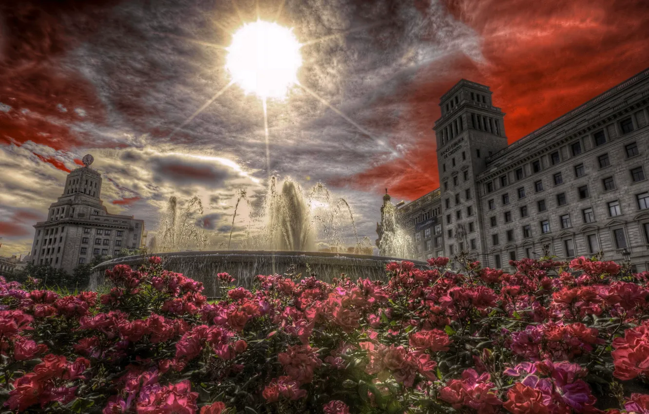Фото обои небо, солнце, цветы, здания, площадь, фонтан, Испания, Барселонаa