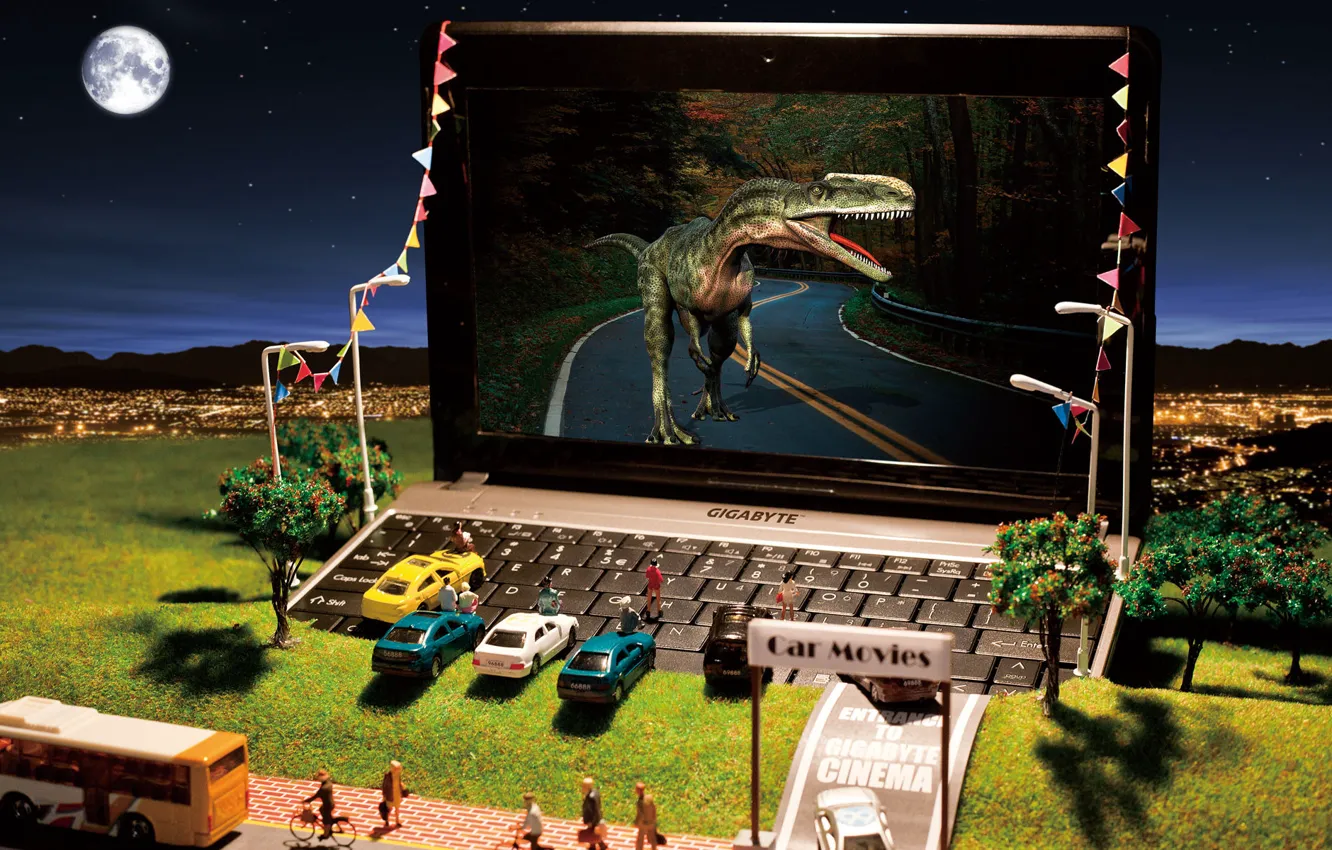 Фото обои машины, город, игрушки, динозавр, холм, фонари, ноутбук, кинотеатр