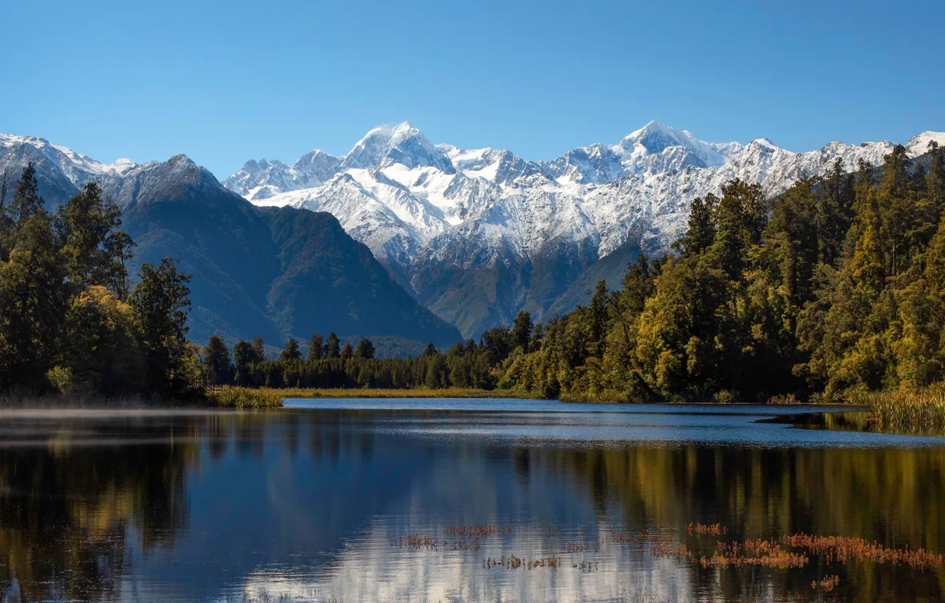 Фото обои небо, солнце, деревья, горы, озеро, Новая Зеландия, New Zealand, Lake Matheson