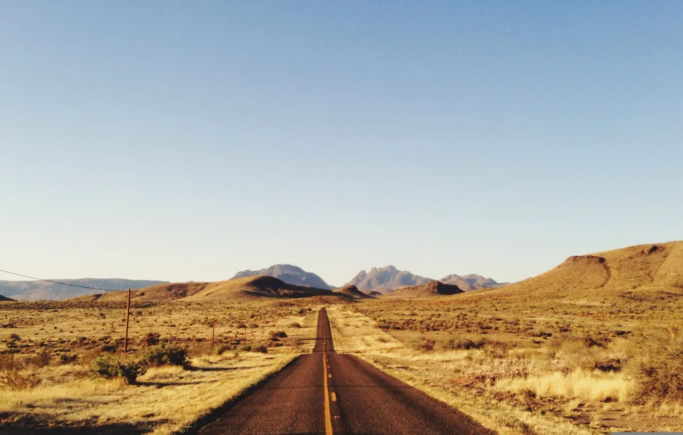 Фото обои road, sky, field, mountains, hills, sunny