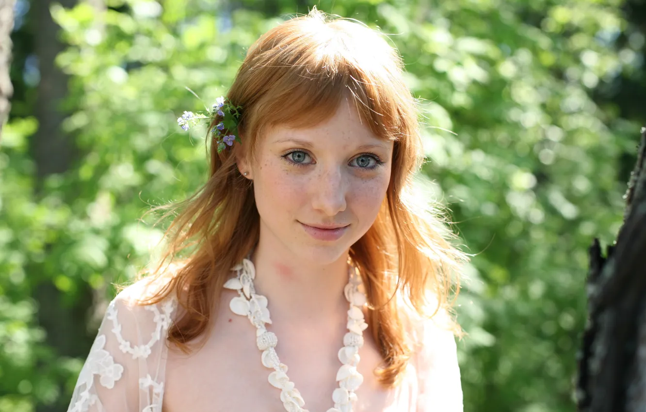 Фото обои girl, grass, long hair, trees, nature, smile, blue eyes, flowers