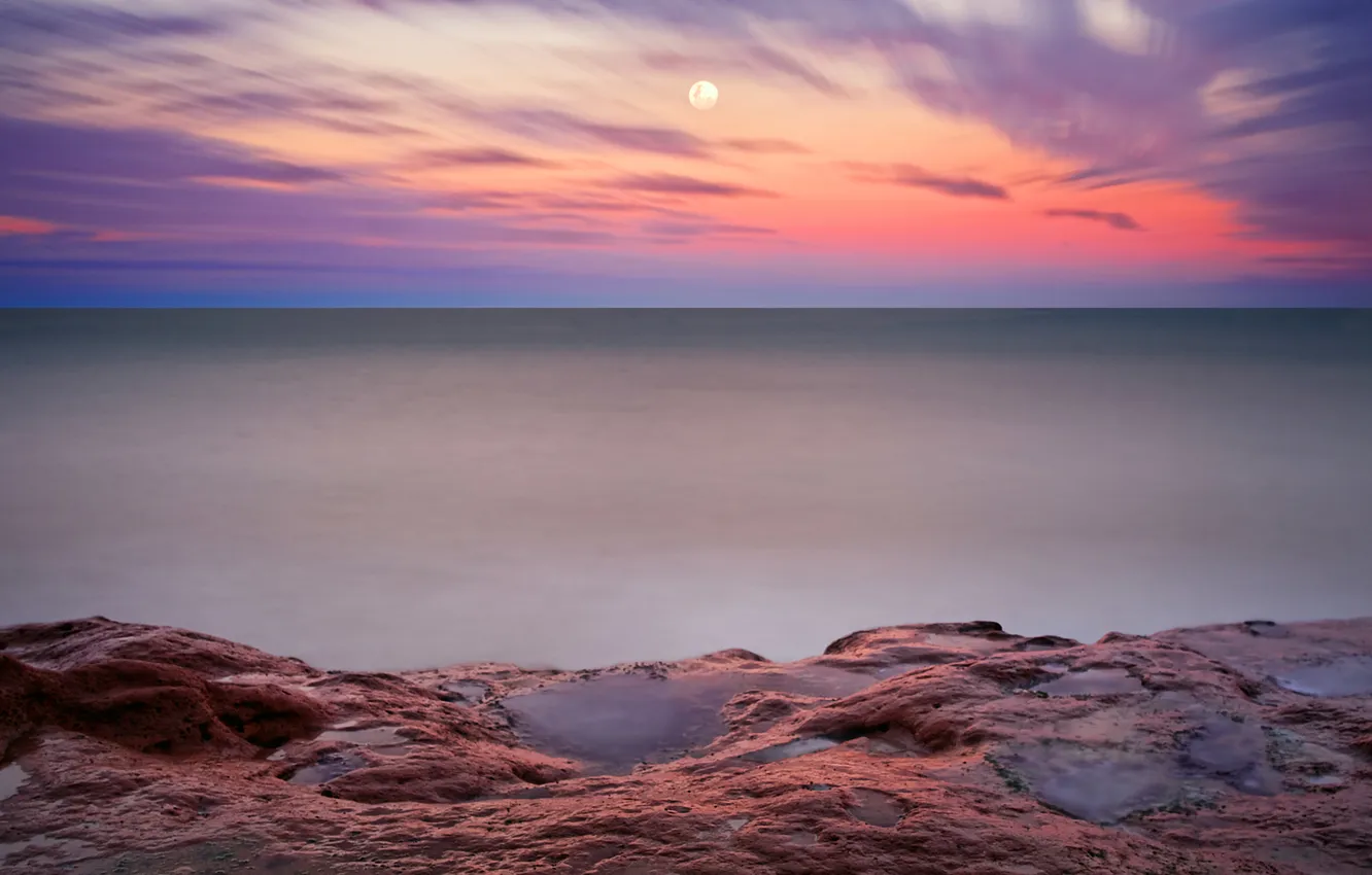 Фото обои море, небо, ночь, камни, луна, вечер, горизонт, аргентина