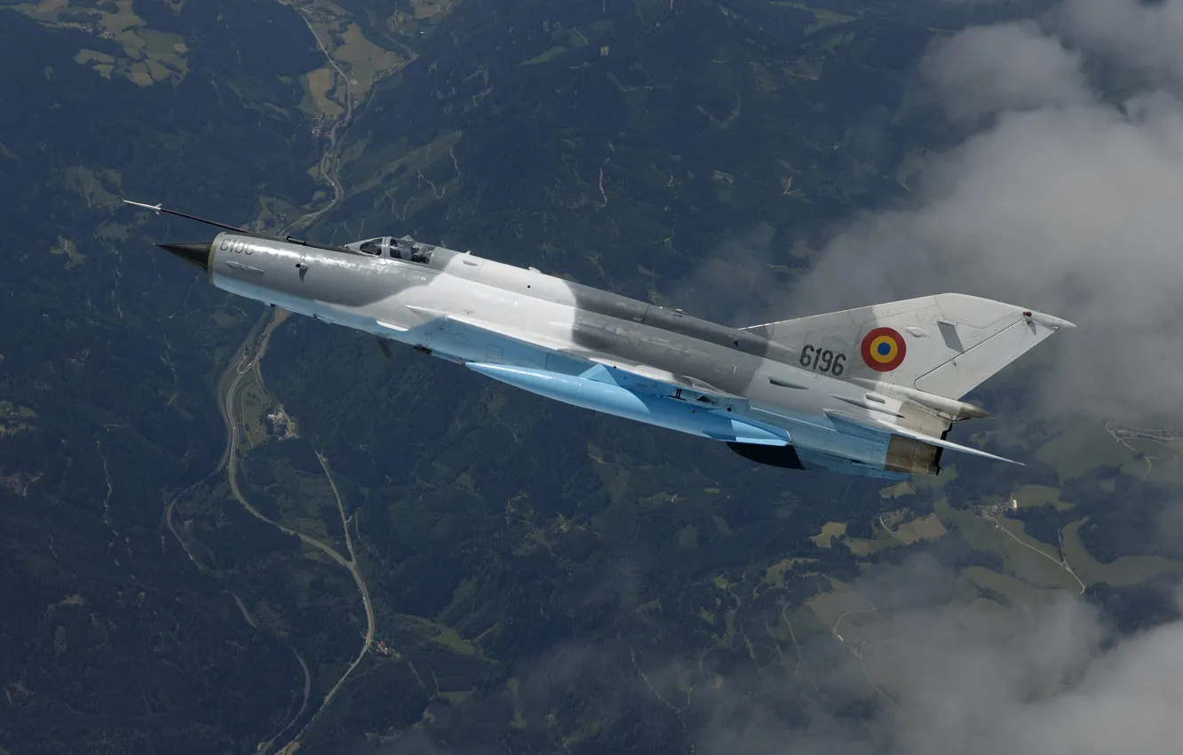 Фото обои облака, полет, истребитель, Lancer, фронтовой, вид с верху, Микоян, Миг 21