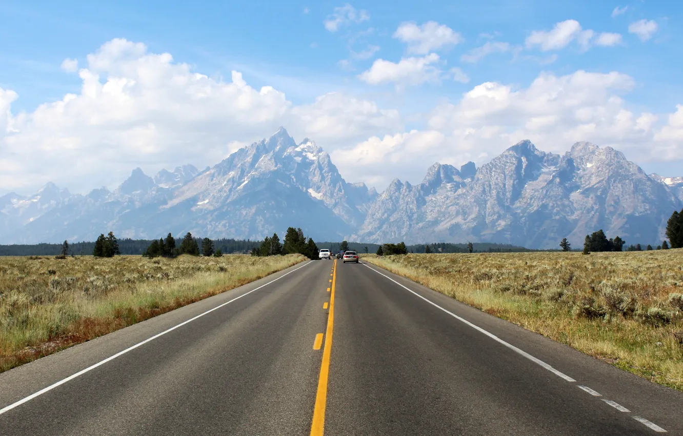 Фото обои road, under, gray asphalt, leading to mountains, cumulus clouds