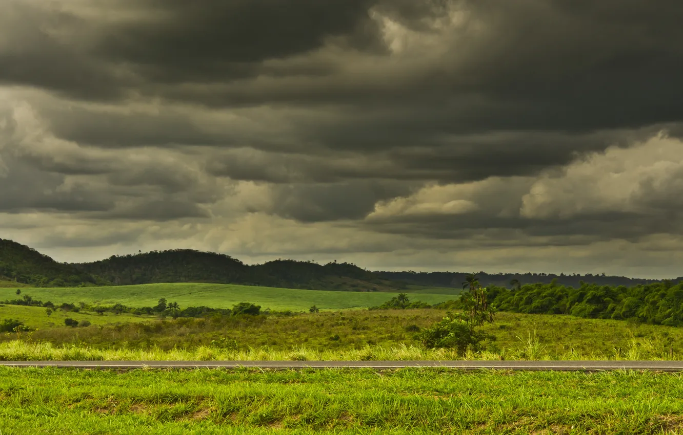 Фото обои дорога, гроза, поле, холмы, серые облака