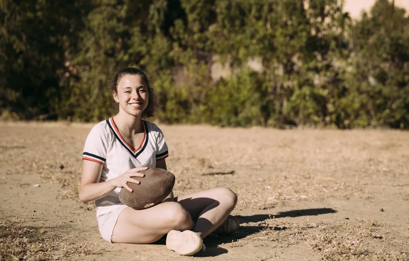 Фото обои cheerful, sitting, rugby ball, teenager